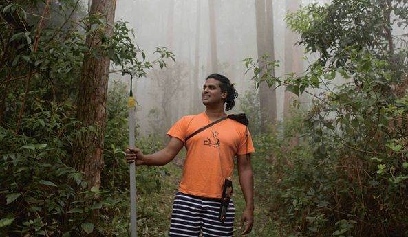 Jacob Cherian photographed in the forest in Kodaikanal, India