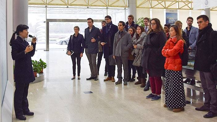 Students listening to the welcome speech at Volkswagen
