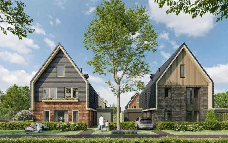Impressie van twee vrijstaande woningen aan een straat in de nieuwe buurt Eureka.