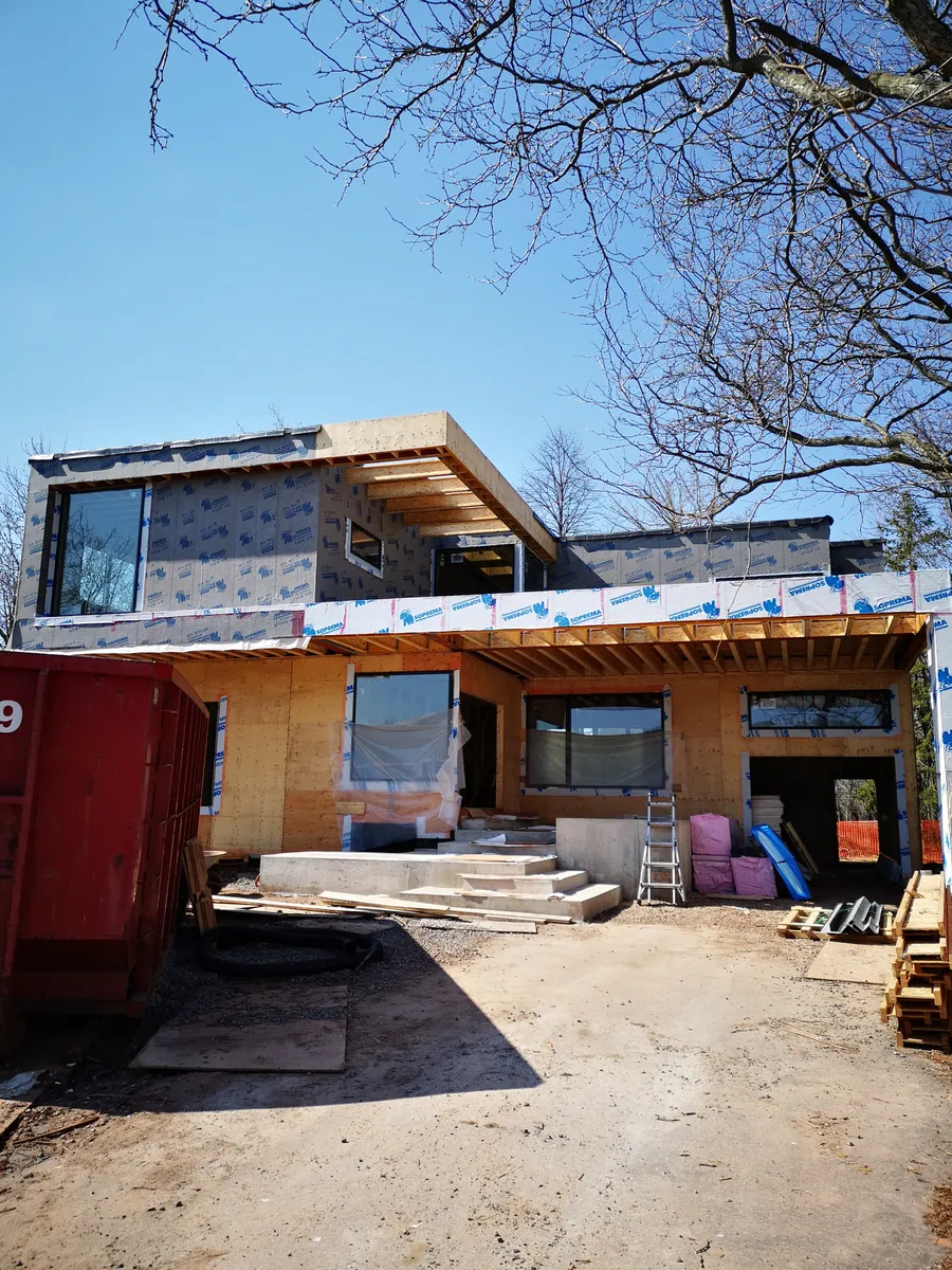 Two-storey residential addition and exterior structural shell