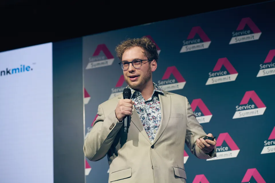 A presentation of blankmile on stage at Service Summit.