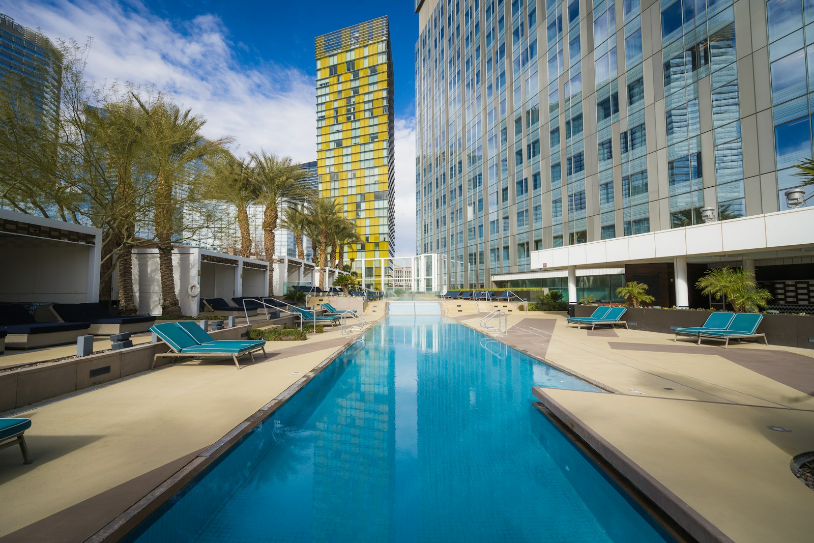 Long resort swimming pool in front of a Las Vegas hotel tower