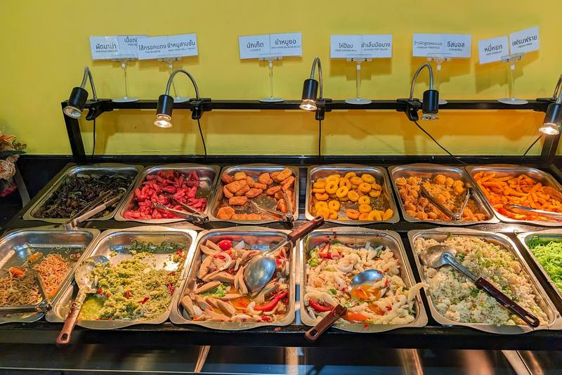 Buffet table filled with a wide variety of dishes