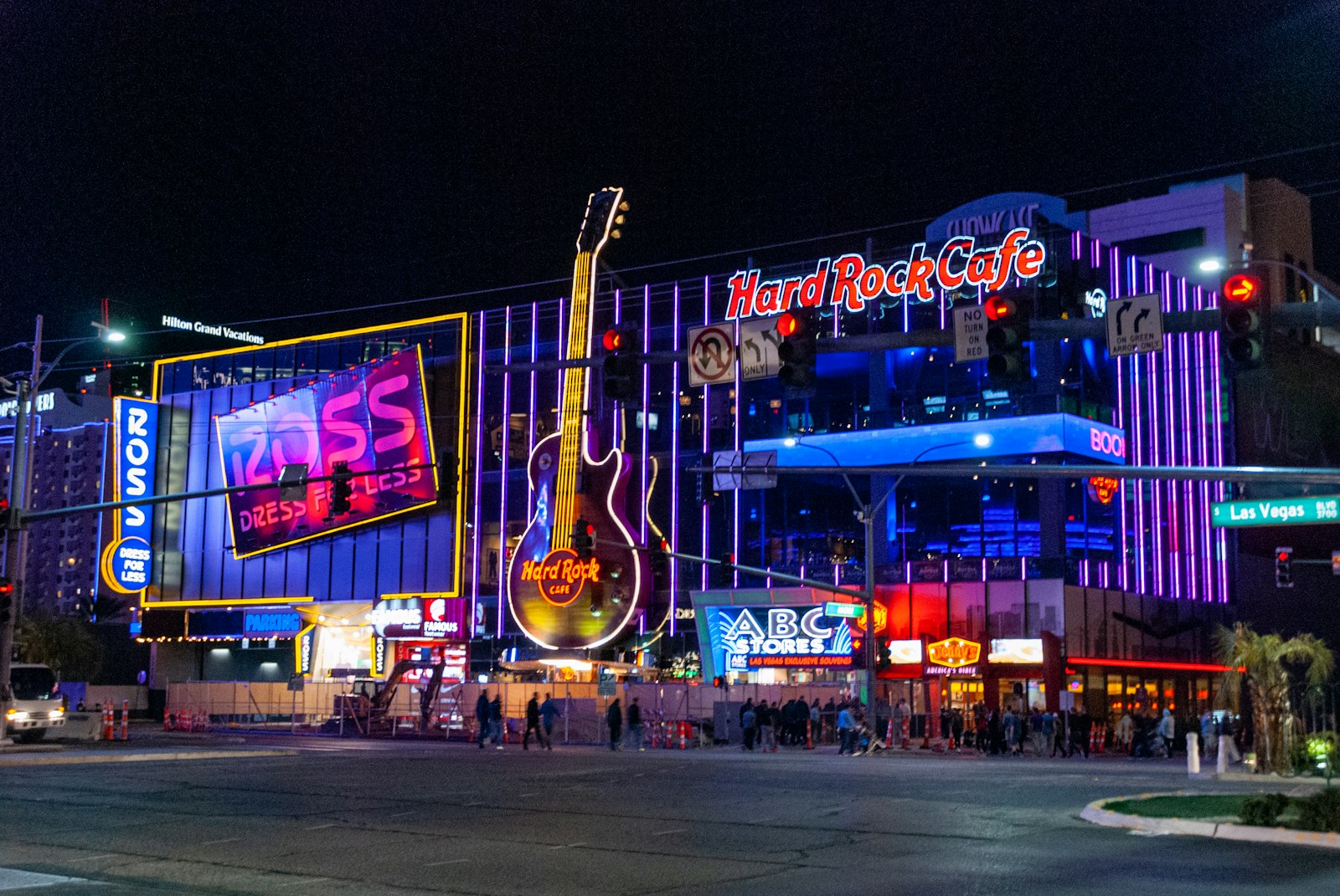 Las Vegas Strip street at night with neon signs including a giant guitar