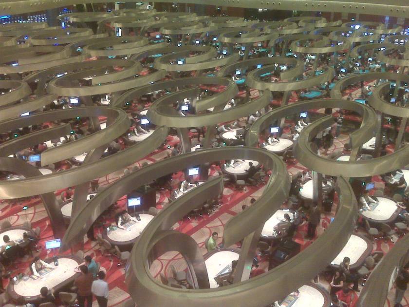 Rows of baccarat tables seen from above in a large casino