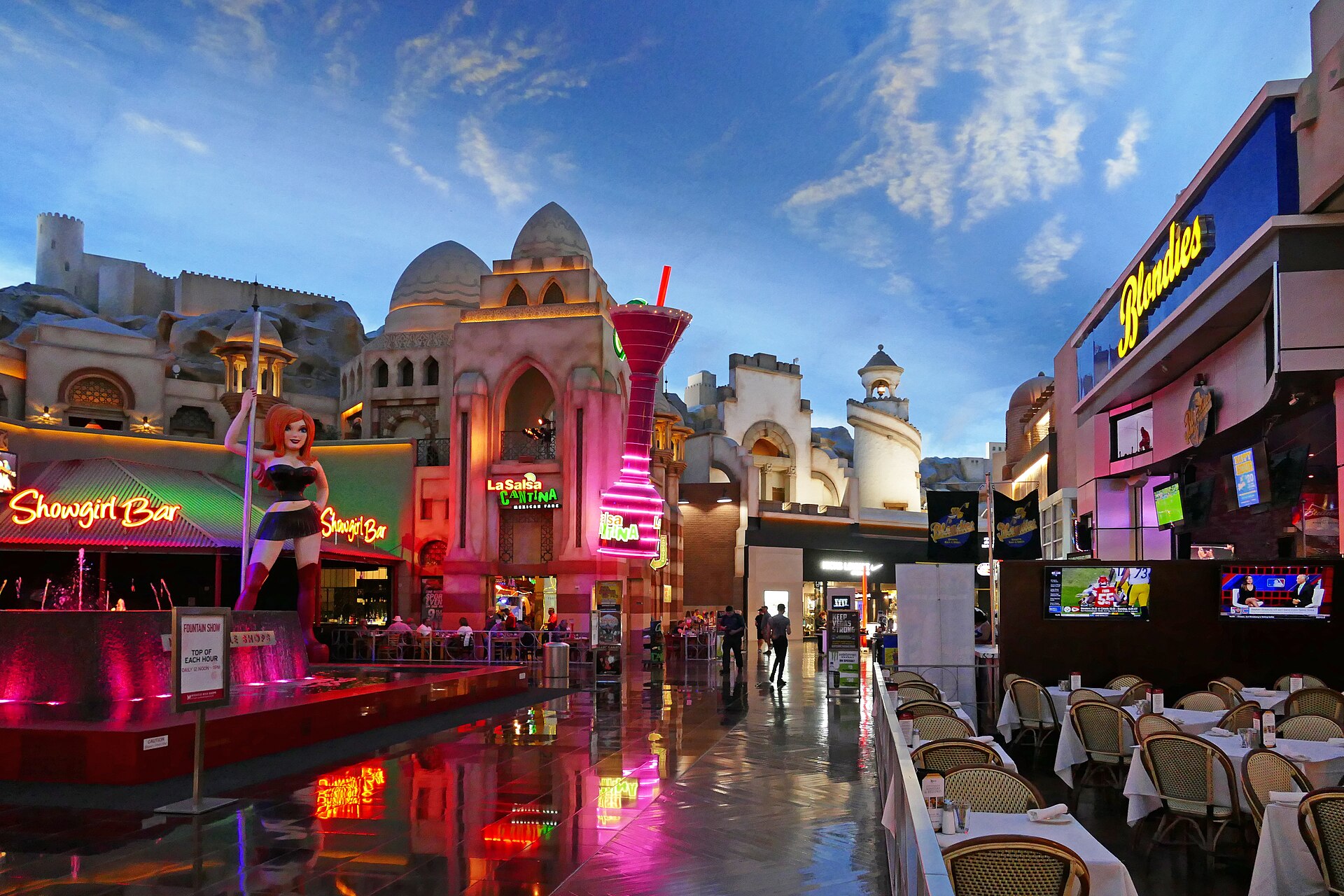 Inside the Miracle Mile Shops at Planet Hollywood with a painted sky ceiling and restaurant patios