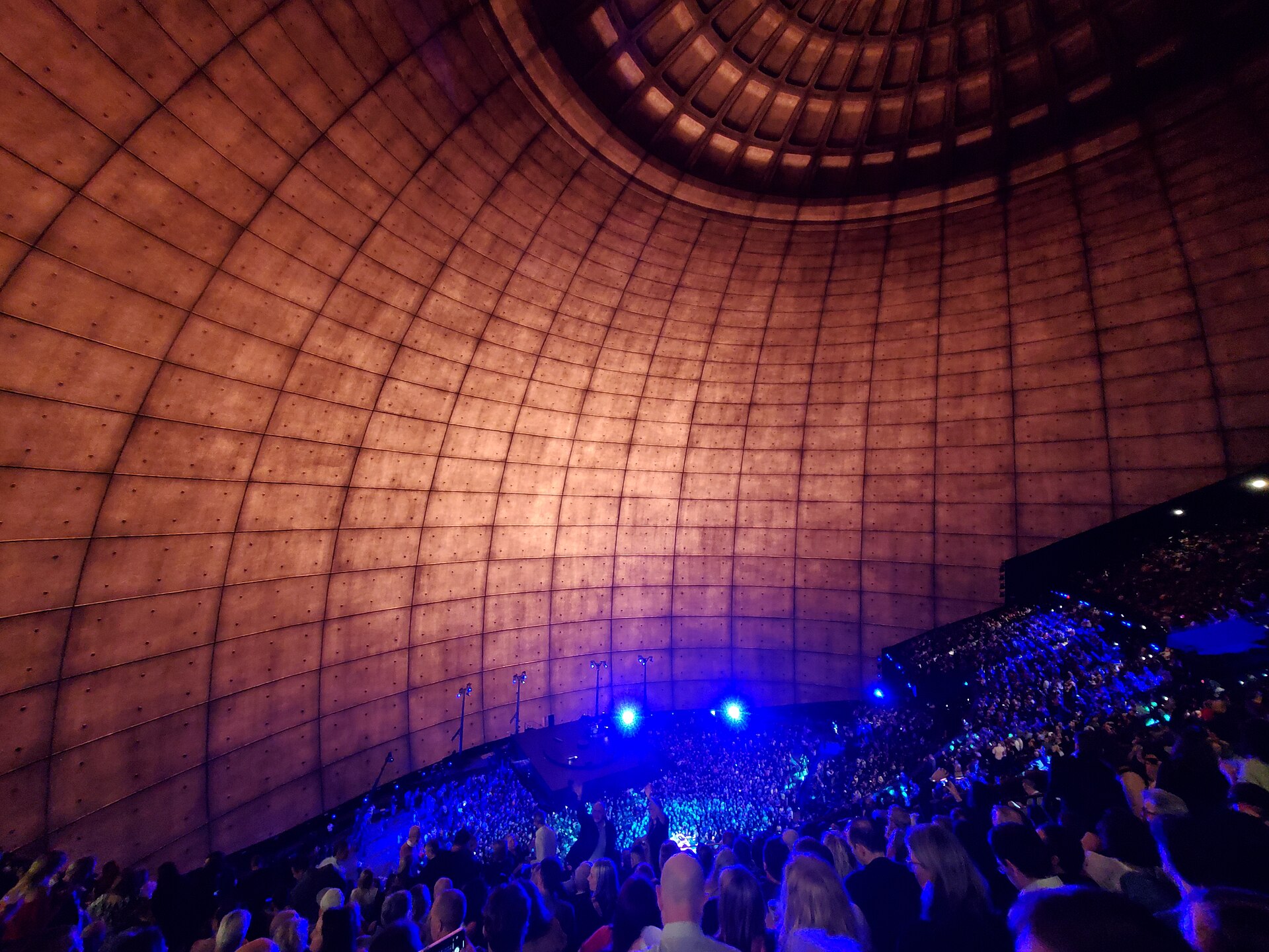 Inside Sphere, the wraparound LED screen shows a concrete dome above a packed crowd before a concert