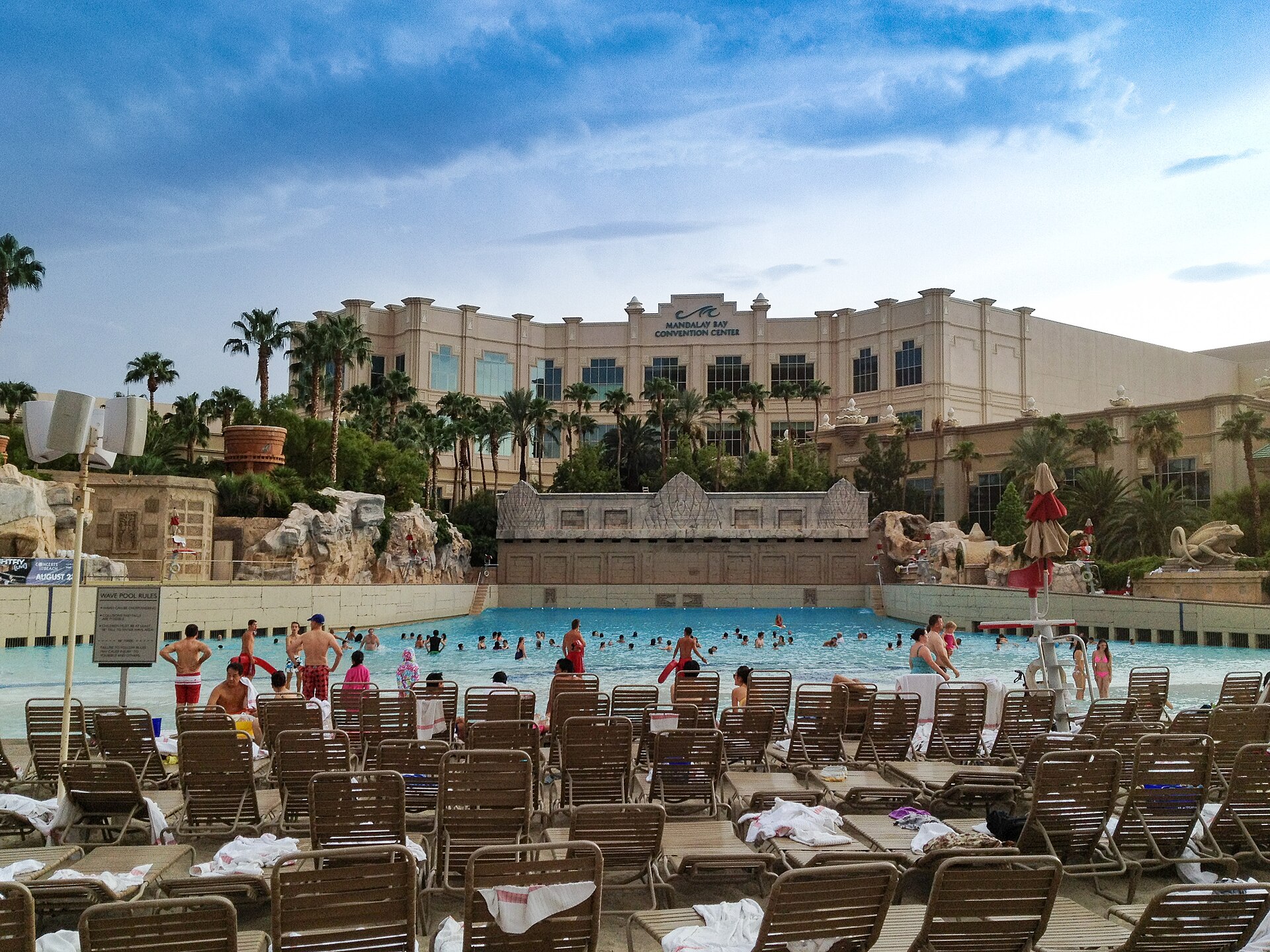 Swimmers in the large wave pool and sandy beach at Mandalay Bay Beach