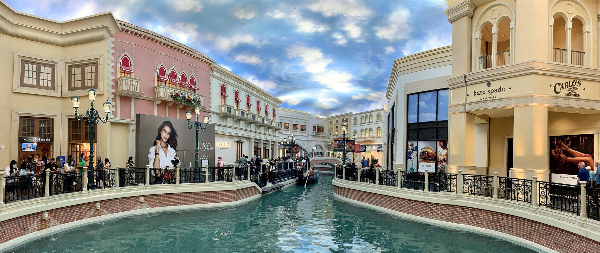 The indoor Grand Canal at The Venetian's Grand Canal Shoppes, with Venetian-style shopfronts under a painted sky ceiling