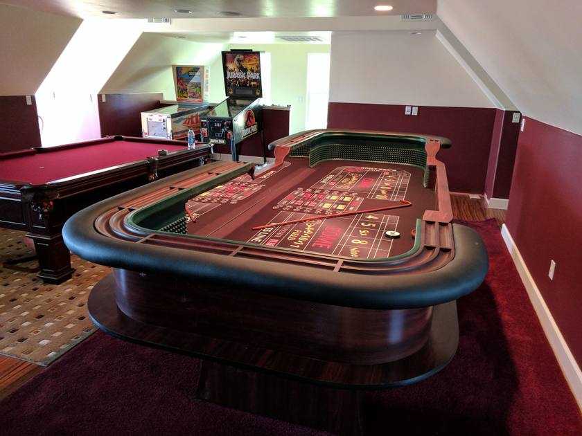 A 12-foot casino-style craps table with green felt layout