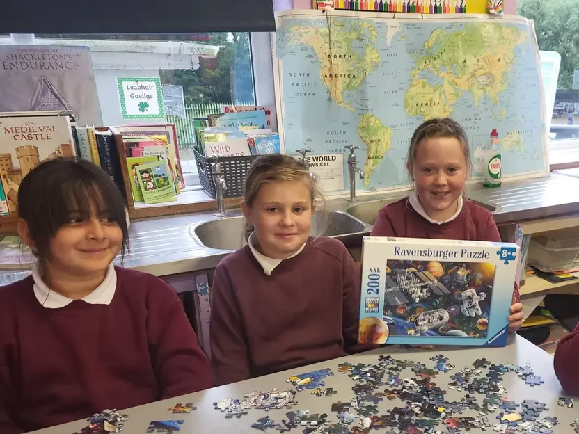 Pupils with a space jigsaw puzzle