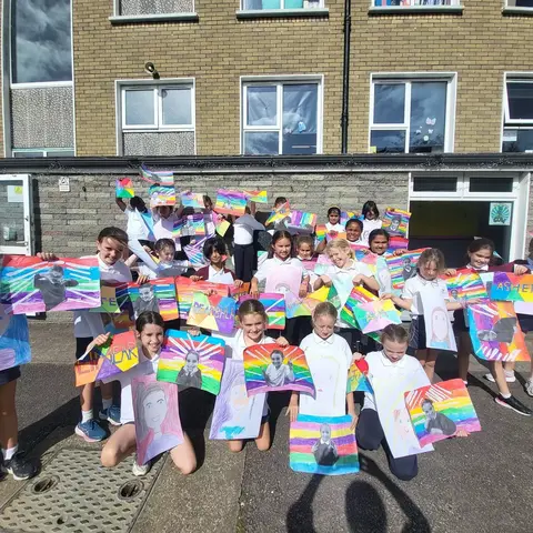 3rd Class pupils holding up their Getting to Know Me artwork (photo 1 of 14)