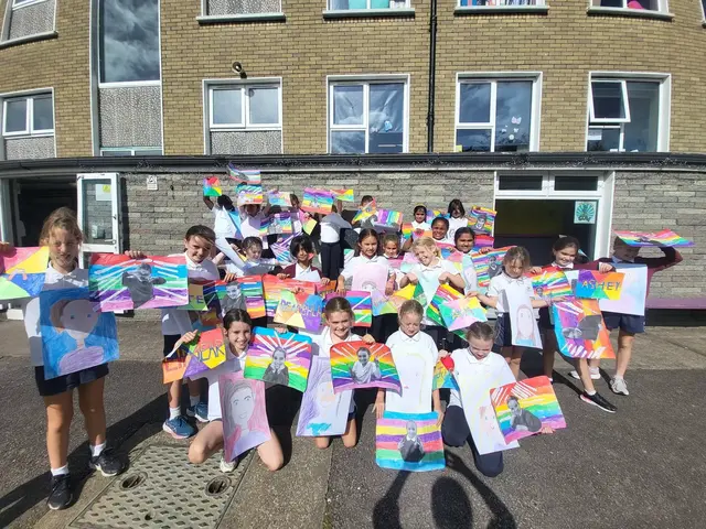 3rd Class pupils holding up their Getting to Know Me artwork (photo 1 of 14)