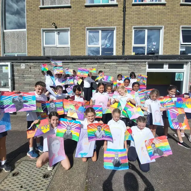 3rd Class pupils holding up their Getting to Know Me artwork (photo 1 of 14)