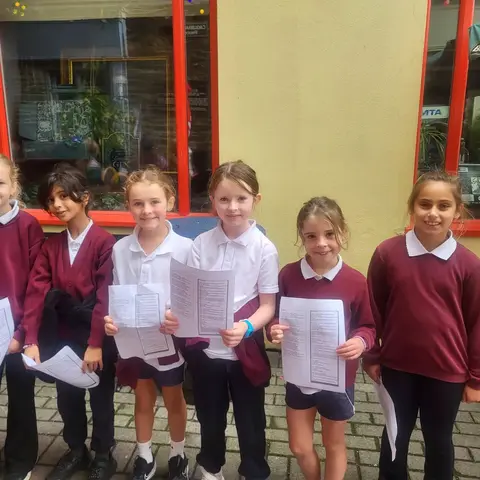 Pupils singing and playing guitar on the street at the Clonakilty International Guitar Festival (photo 6 of 7)