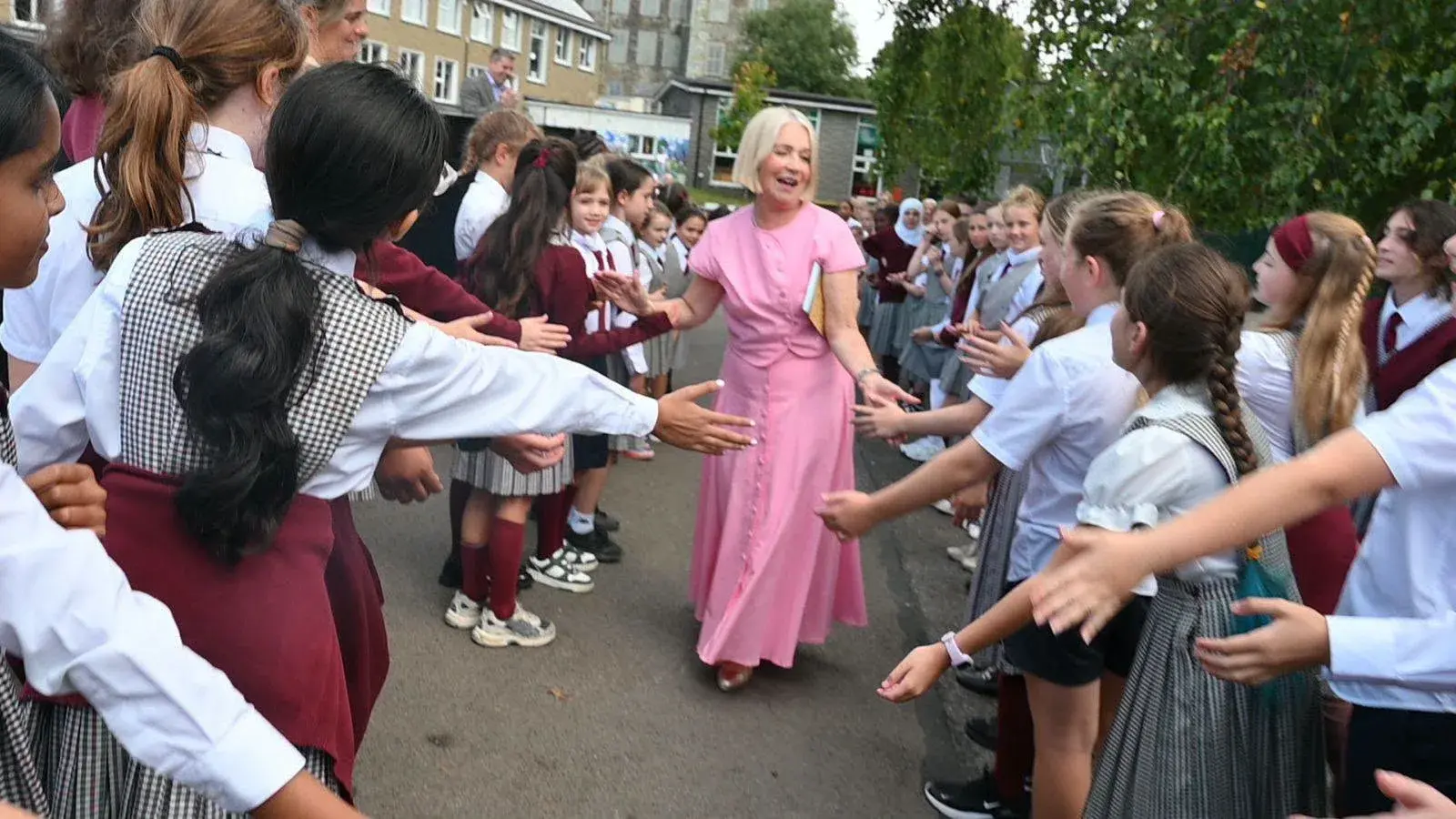Pupils lining the yard to give Elma a guard of honour on her retirement