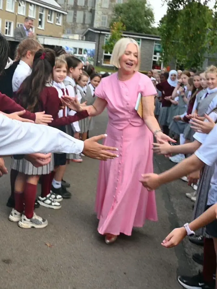 Pupils lining the yard to give Elma a guard of honour on her retirement