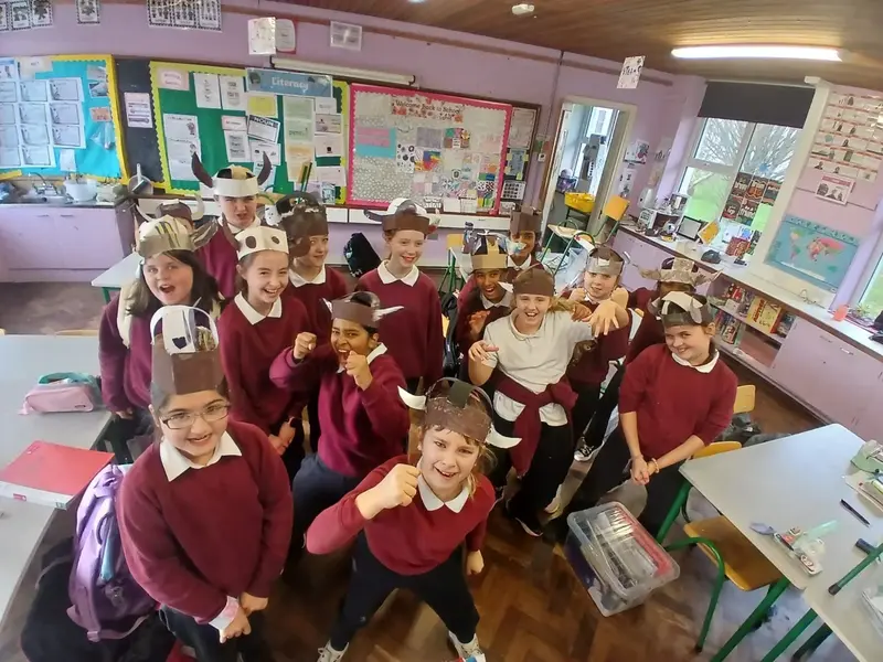 Pupils wearing paper Viking helmets they made in class