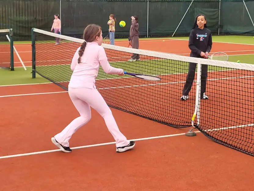 Pupils playing tennis