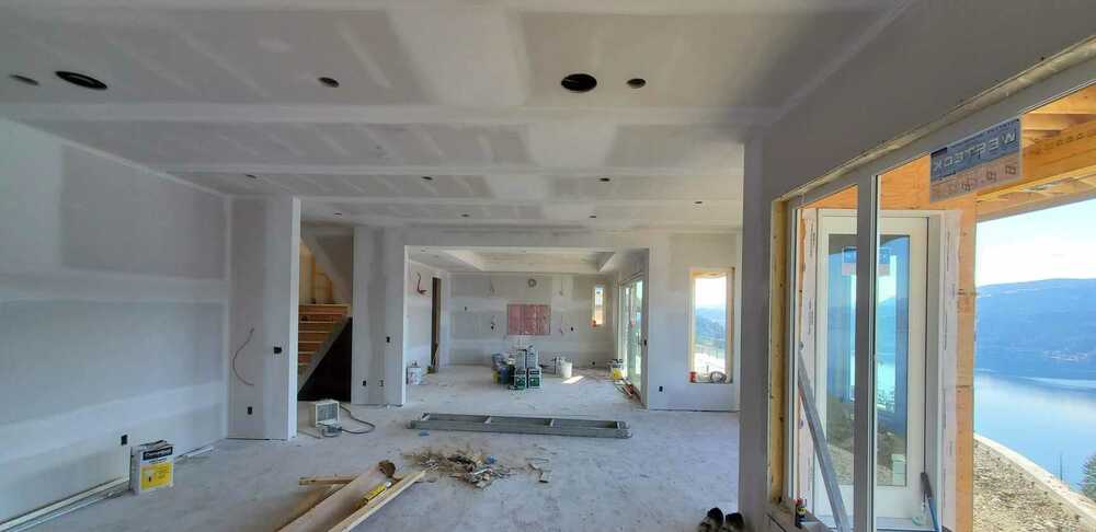 Direct Drywall Finishing project with newly finished walls and ceilings