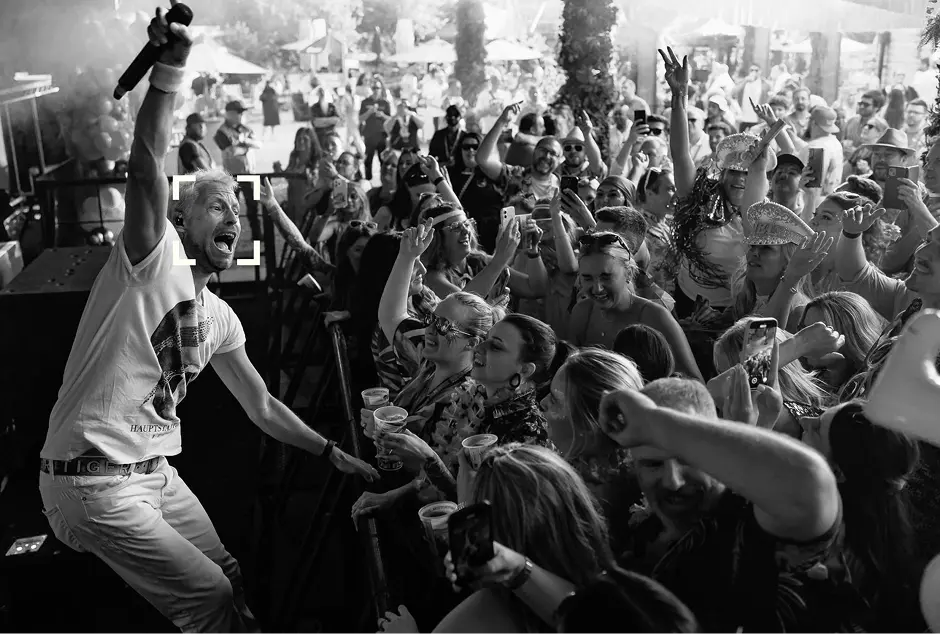 Loft One12 — performer on stage with crowd (wide)