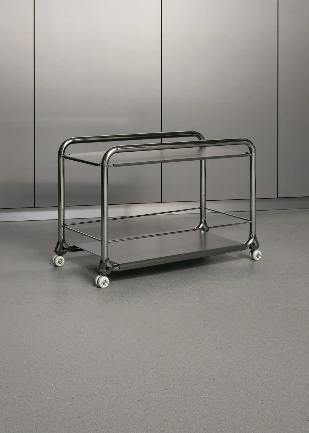 Tension trolley in chrome and stainless steel against a metal wall