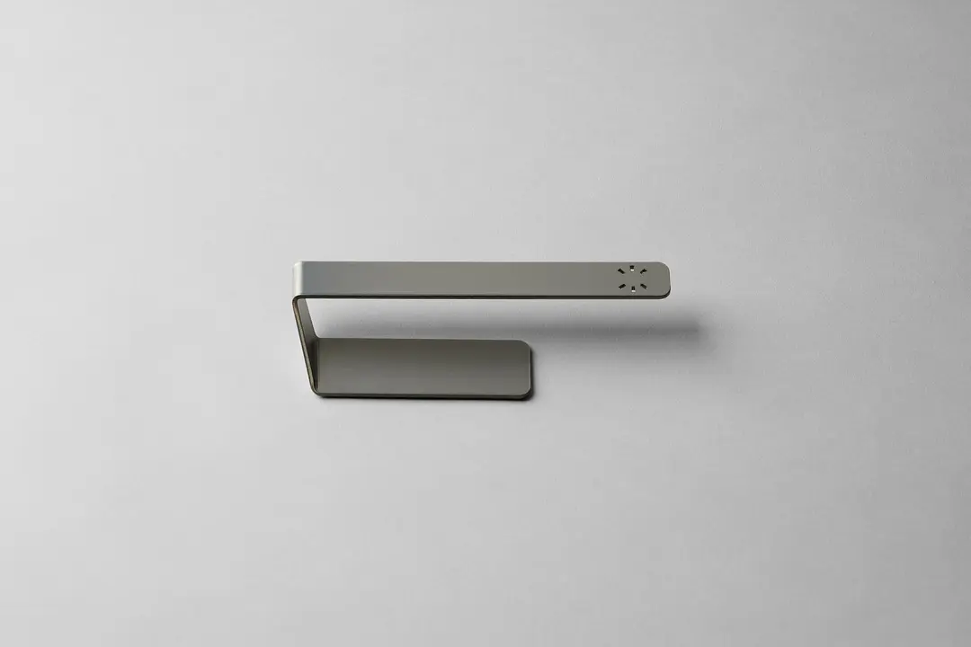 Steel dishcloth hanger on a white surface