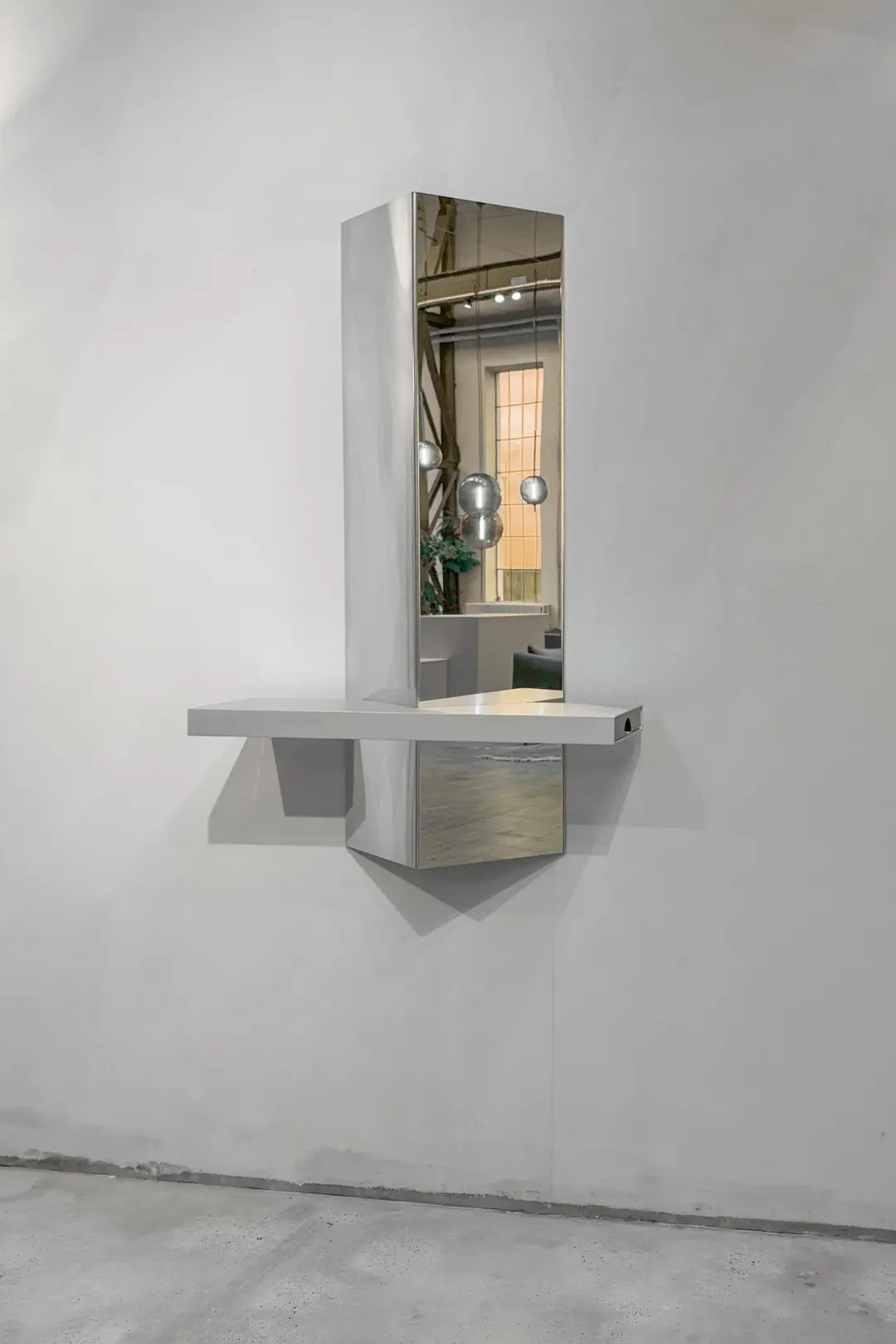 Stash mirror and shelf on a concrete wall