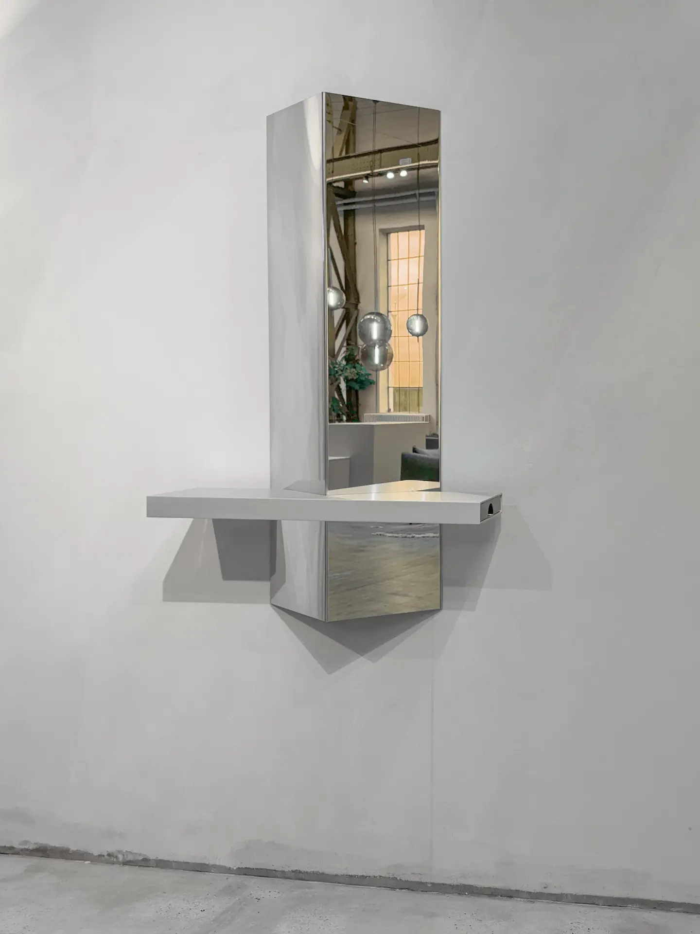 Stash mirror and shelf on a concrete wall