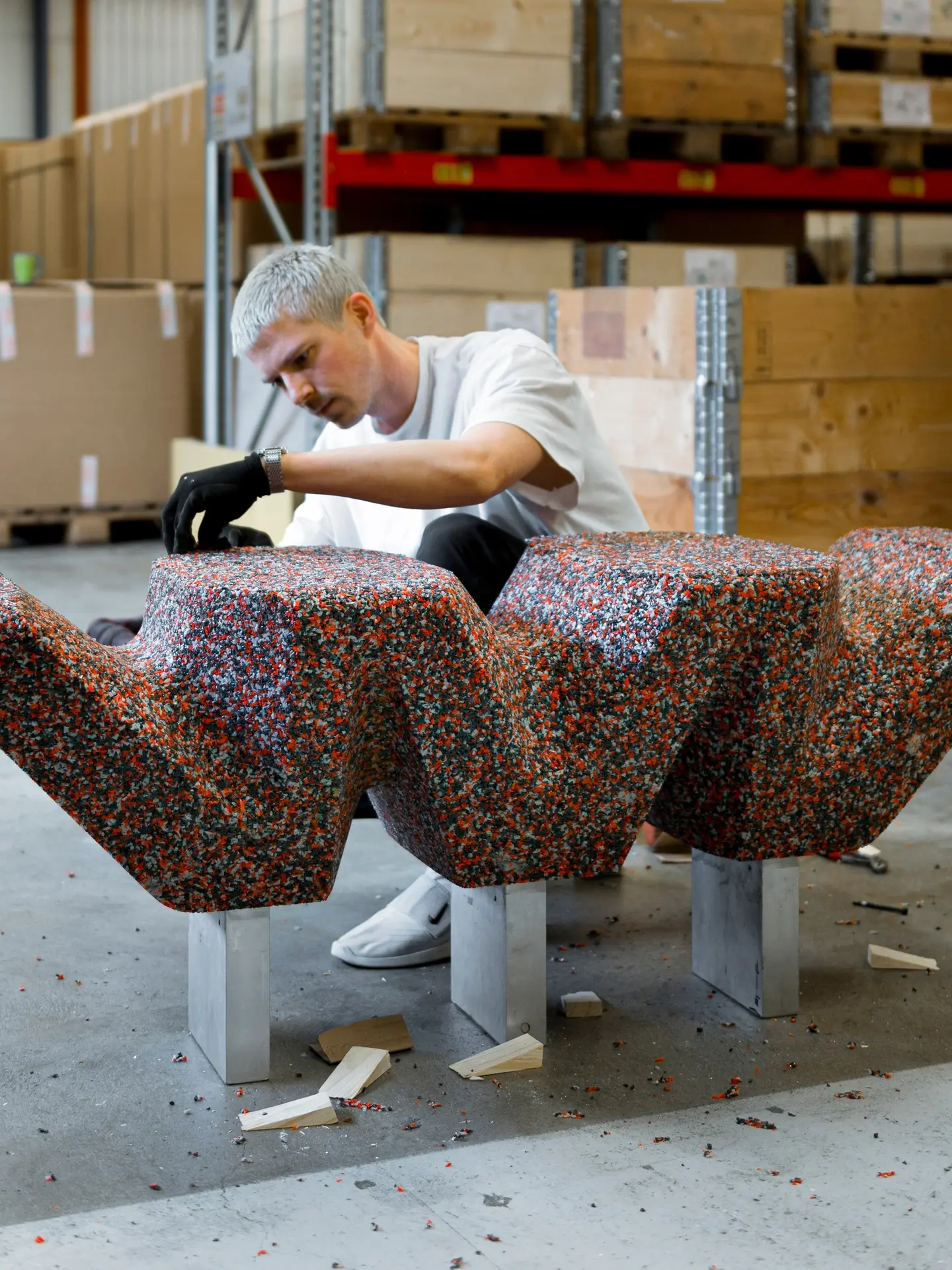 Gustav Winsth working on the speckled base in a warehouse