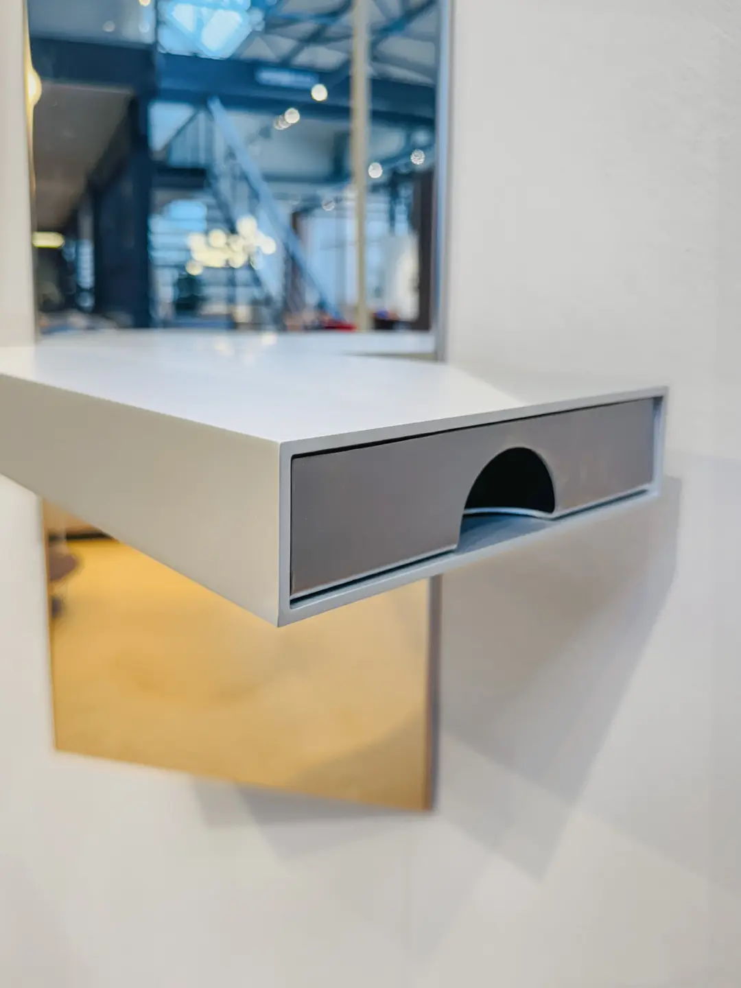 Close-up of the pull-out drawer under the shelf