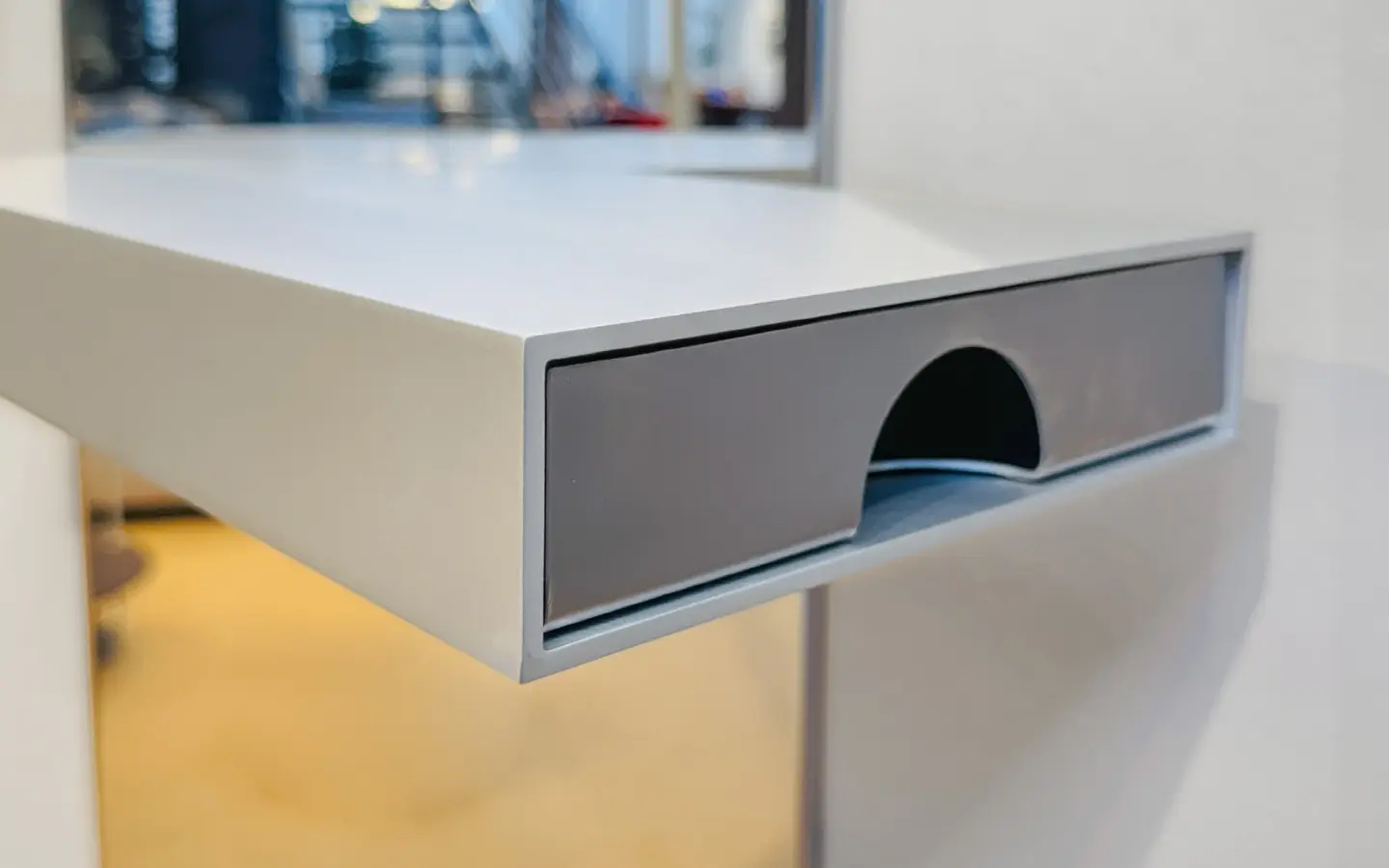 Close-up of the pull-out drawer under the shelf