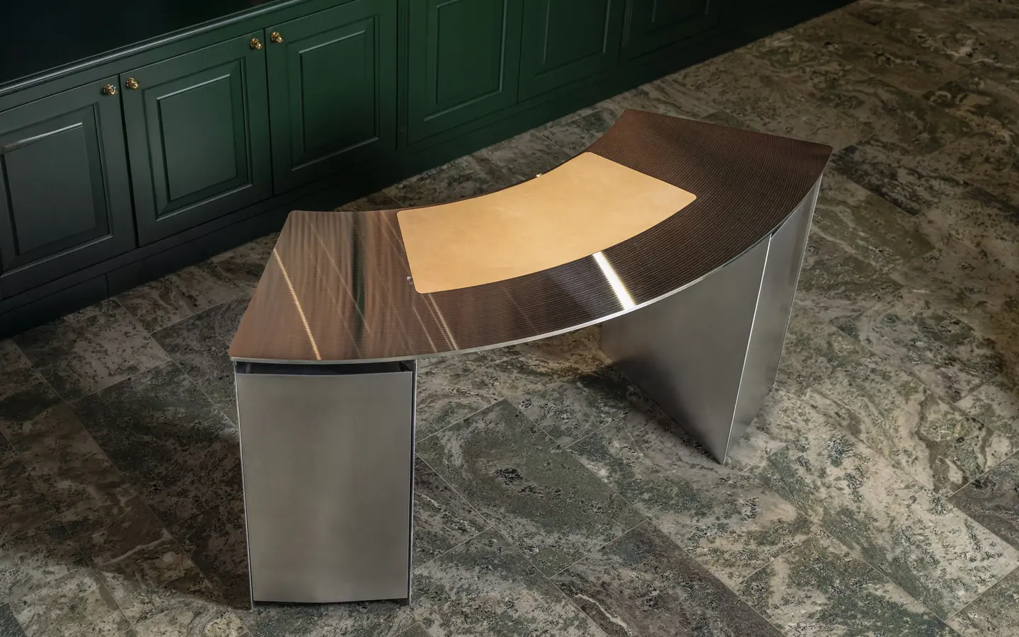 CD desk in front of green panelled cabinets