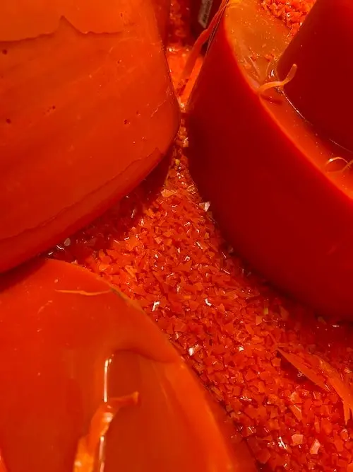 Close-up of the glossy red-orange base