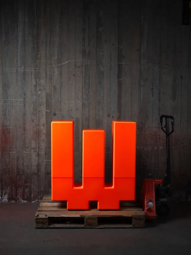 Fluorescent orange Inferno on a pallet with a pallet jack
