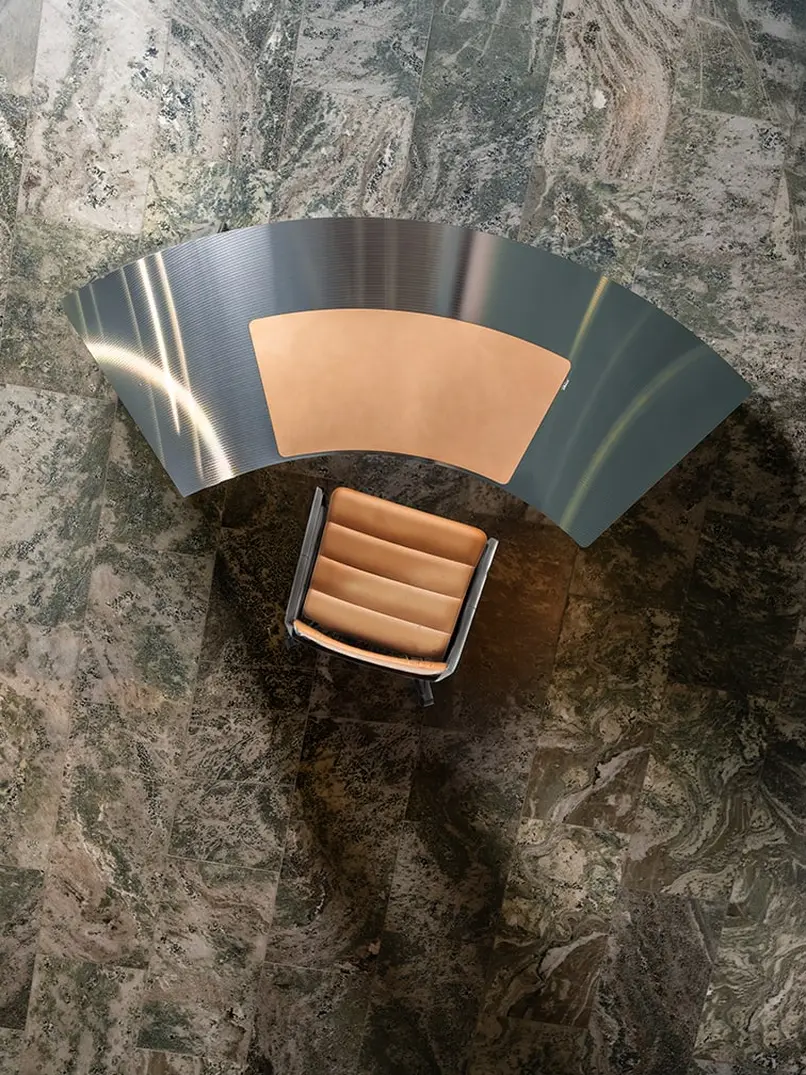 The CD desk and a leather chair seen from above on a marble floor