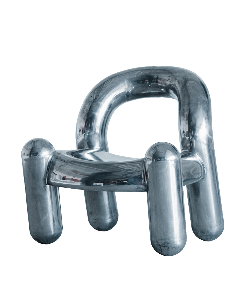 Reality armchair in chrome with thick rounded tubular legs and arms