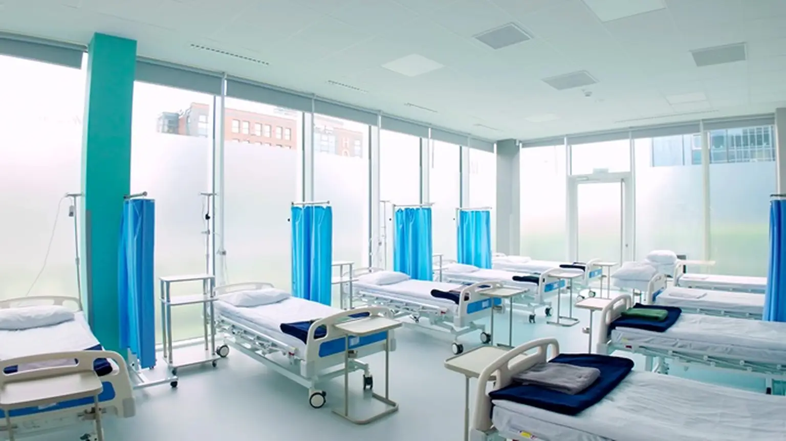 A room full of hospital beds in MTZ Pratia