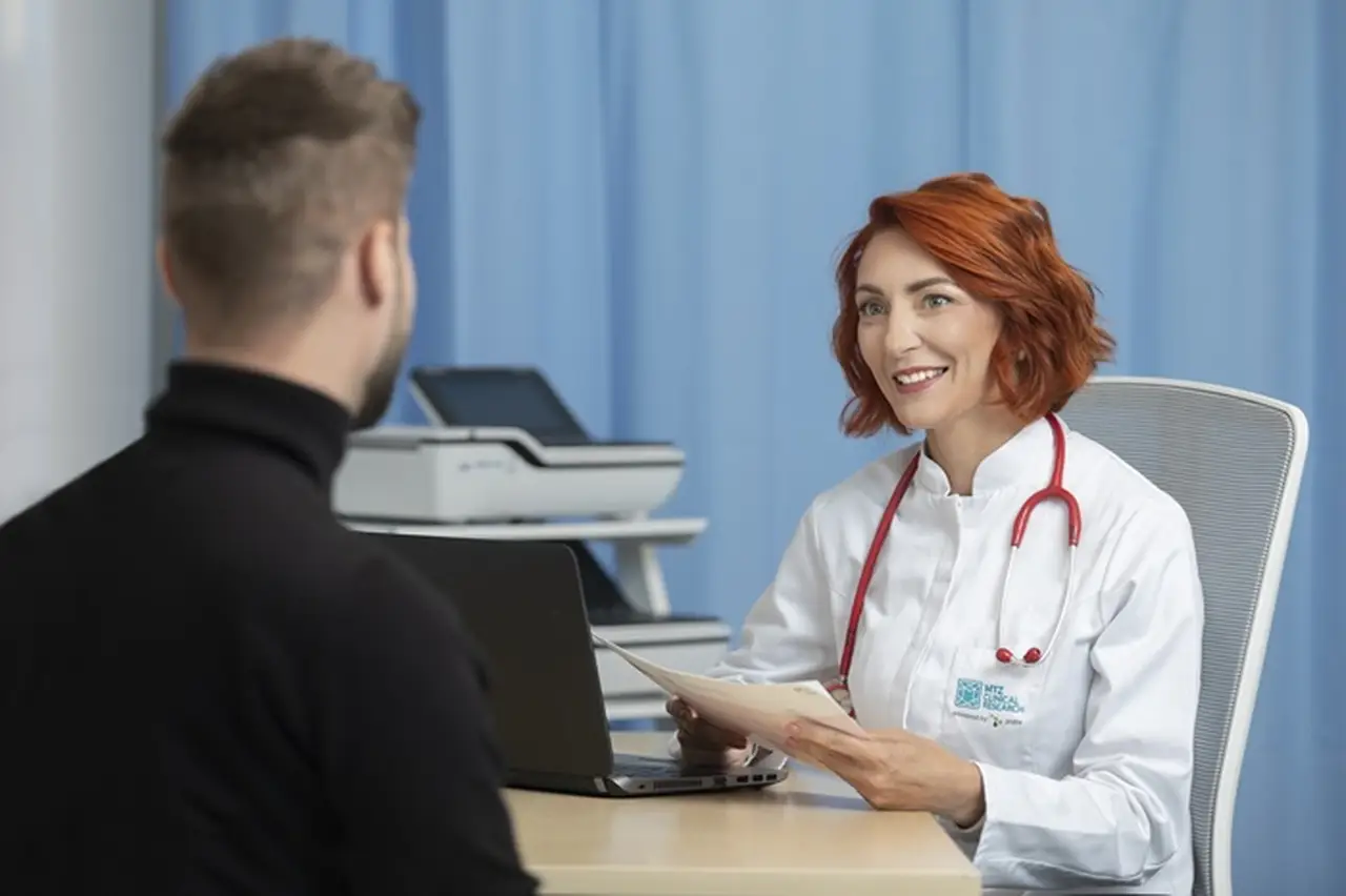 Medical staff talking to a patient