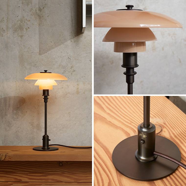 Dette billede viser en glas lampeskærme og en metal base med Poul Henningsens signatur