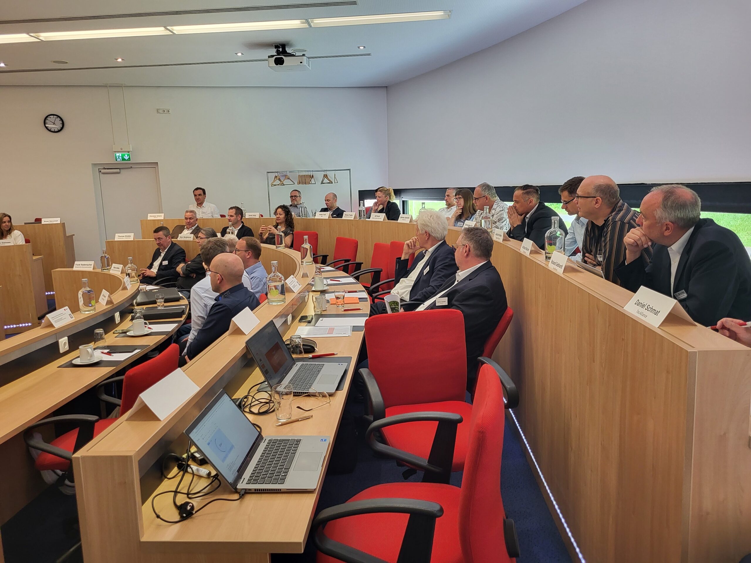 Audience listening at TecCom Community Meeting conference room