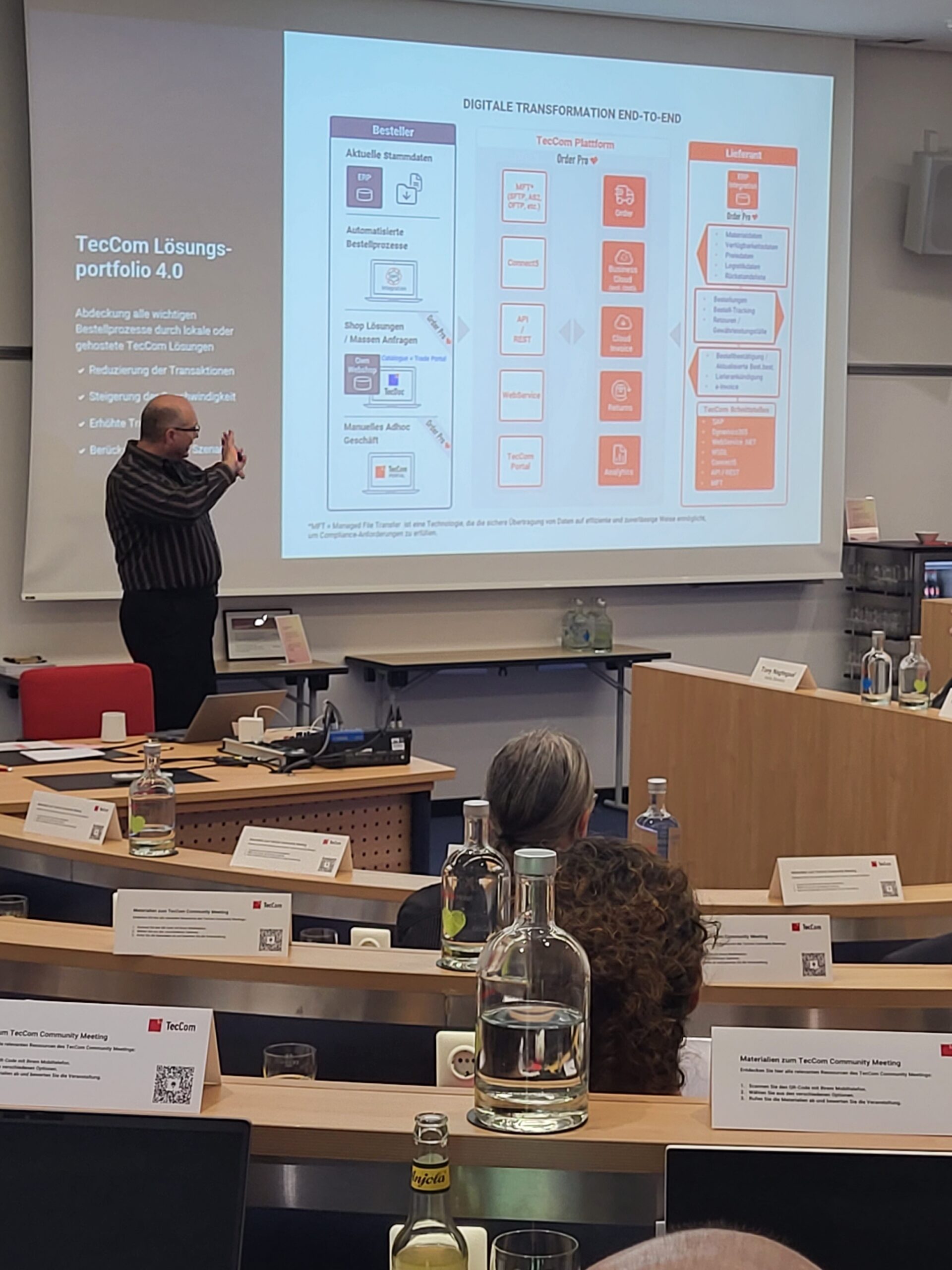 Speaker presenting TecCom digital transformation at community meeting
