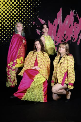 Photo of four female models wearing different pink and yellow outfits