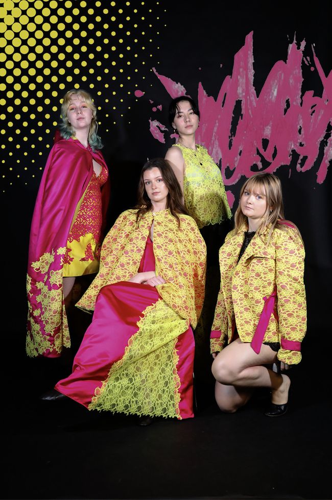 Photo of four female models wearing different pink and yellow outfits
