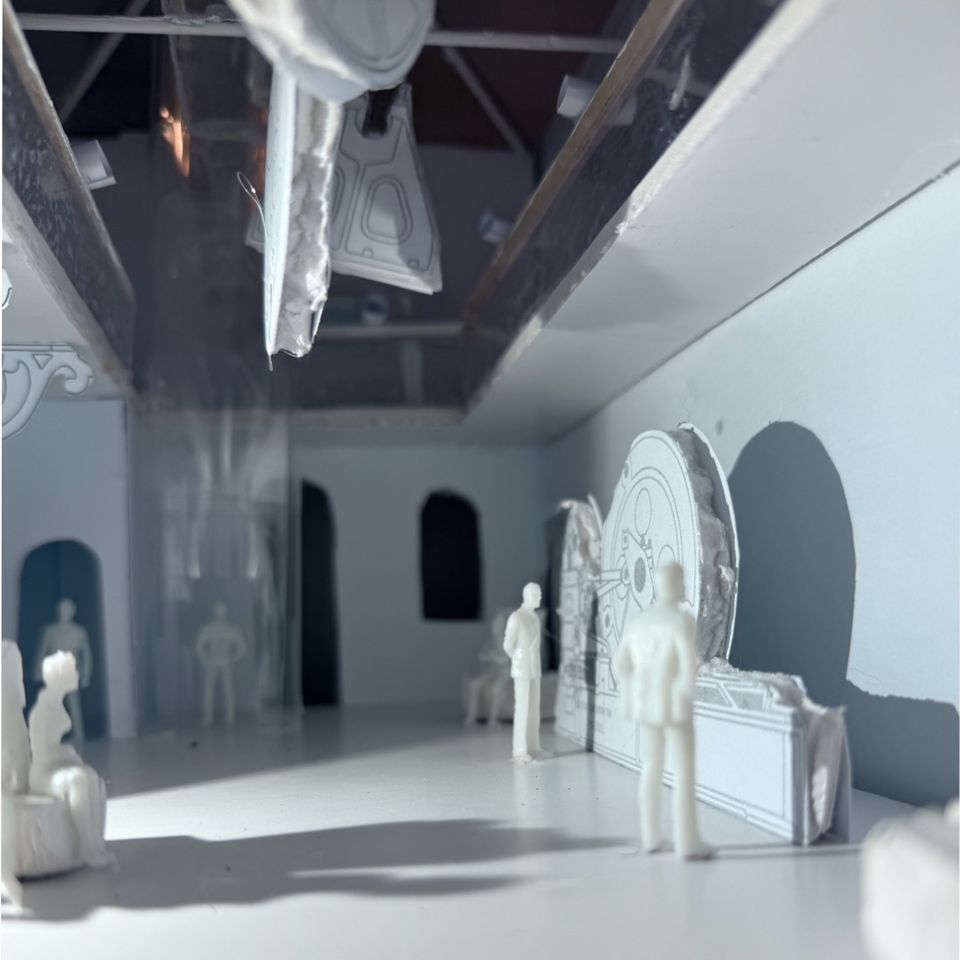 Model of people walking around mock up of museum steam room