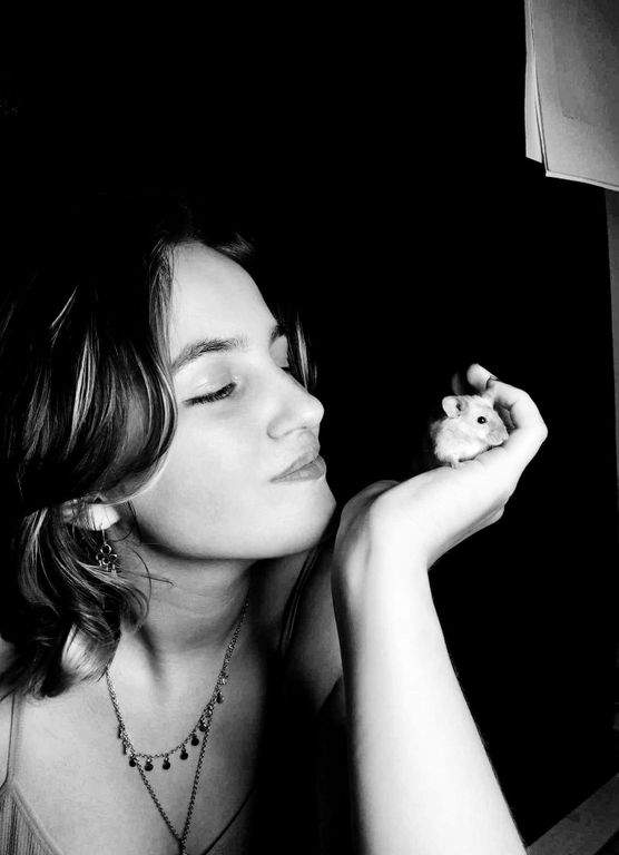 Maddie holding a mouse in her hand