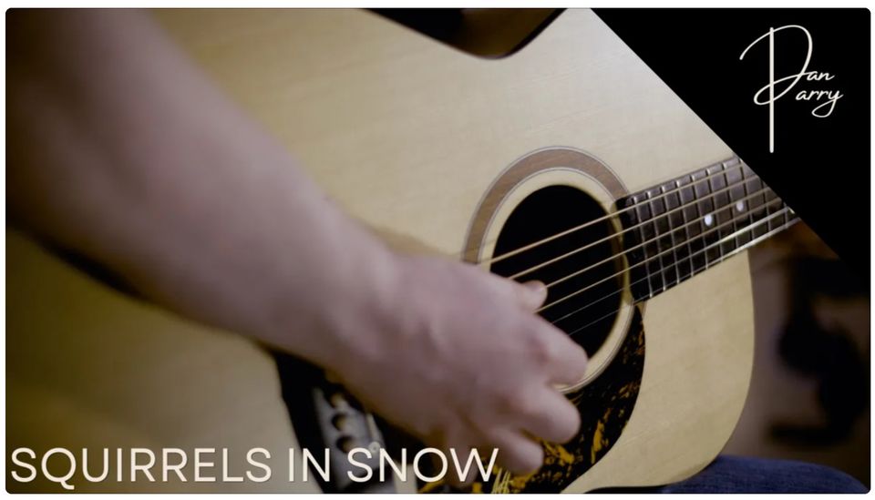 An acoustic guitar with hands playing it, title "Squirrels in Snow" along the bottom