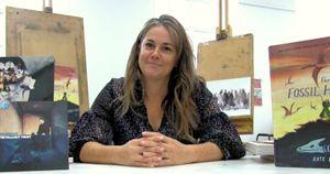 Kate Winter surrounded by her illustration work