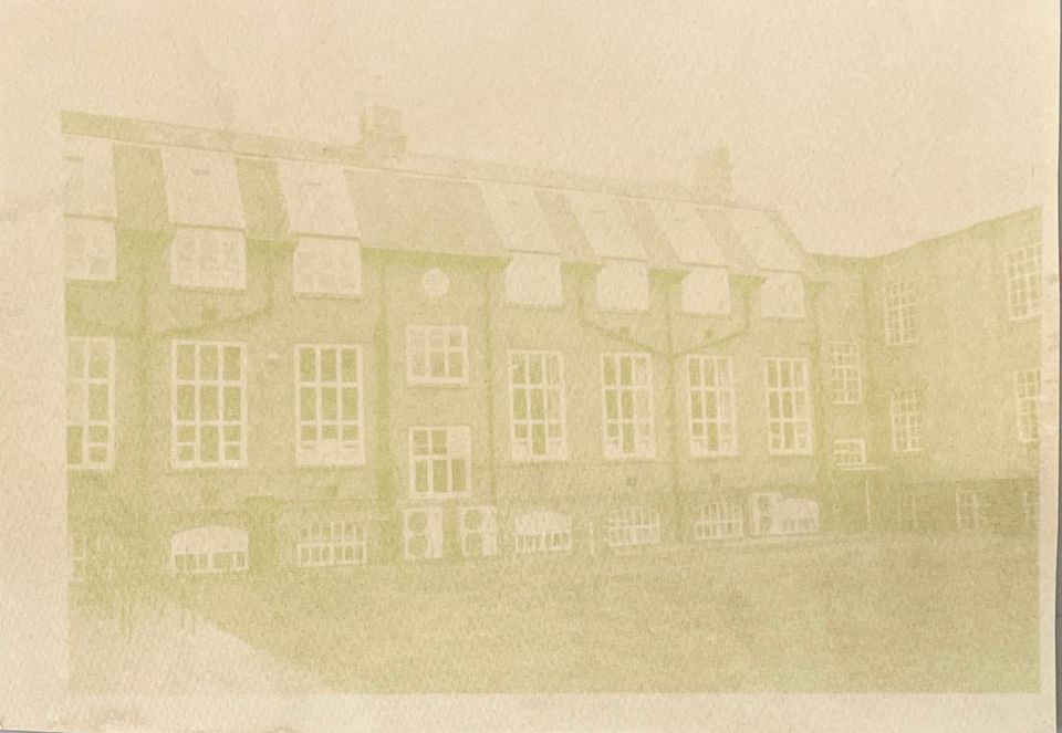 Faded sepia photo of tall terraced housing