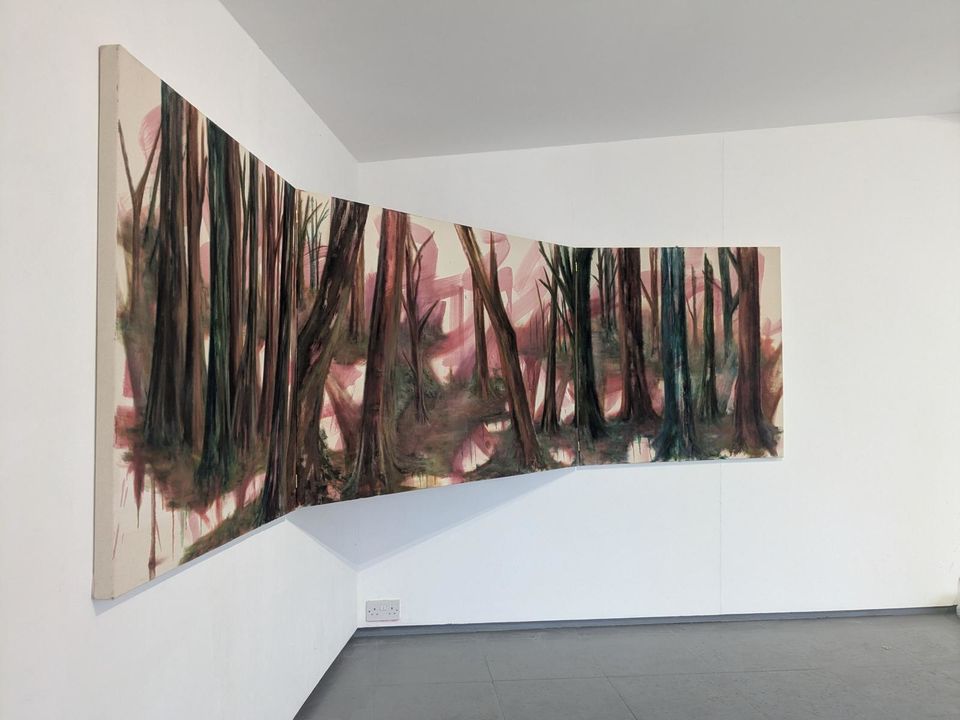 Painting of trees in gallery, suspended across the meeting of two walls